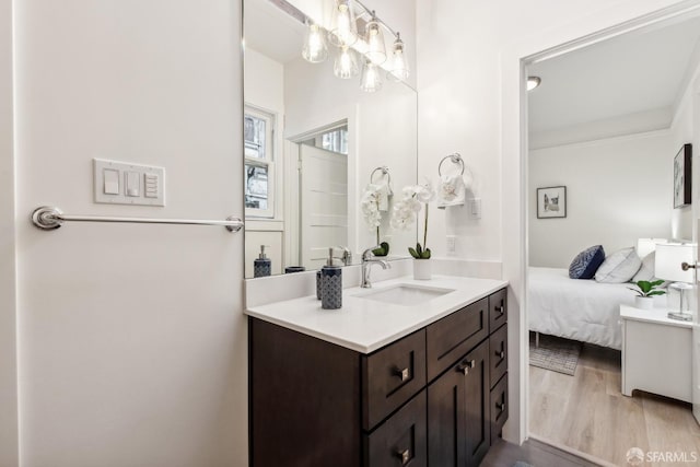 1015 Key Ave, San Francisco, CA 94124 - bathroom featuring vanity, wood finished floors, connected bathroom, and a chandelier
