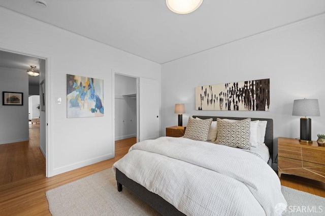 57 Masonic Ave, San Francisco, CA 94118 - bedroom featuring wood finished floors, crown molding, and a closet