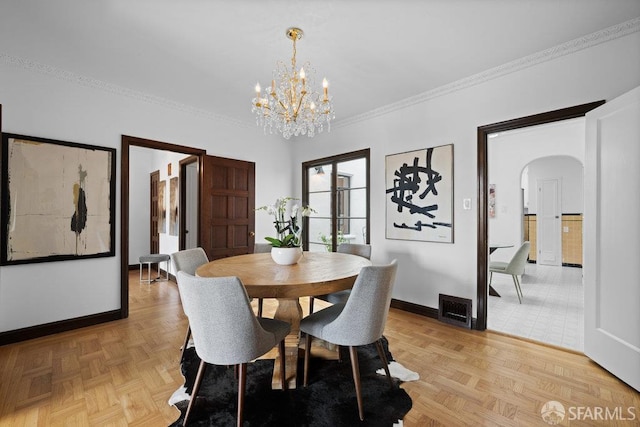 57 Masonic Ave, San Francisco, CA 94118 - dining space with a chandelier, arched walkways, and ornamental molding