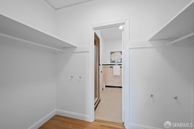 57 Masonic Ave, San Francisco, CA 94118 - walk in closet featuring light wood-style flooring