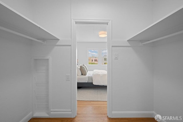 57 Masonic Ave, San Francisco, CA 94118 - walk in closet featuring wood finished floors