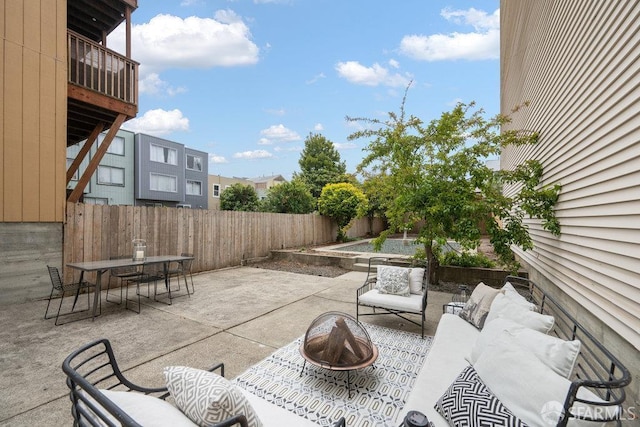 57 Masonic Ave, San Francisco, CA 94118 - fenced backyard featuring an outdoor living space with a fire pit, a patio area, and outdoor dining space