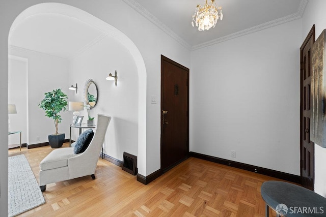 57 Masonic Ave, San Francisco, CA 94118 - entryway featuring arched walkways, crown molding, and a chandelier