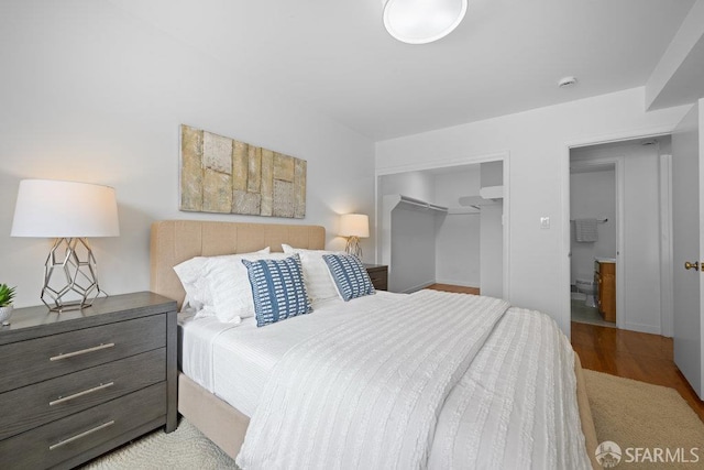 57 Masonic Ave, San Francisco, CA 94118 - bedroom with a walk in closet, wood finished floors, and a closet