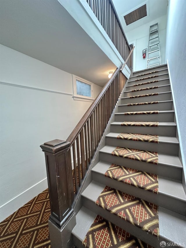 stairs featuring baseboards