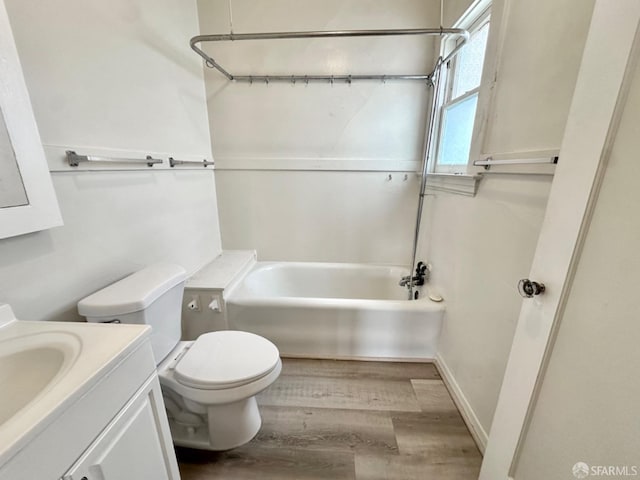 full bathroom with toilet, vanity, wood finished floors, and bathing tub / shower combination