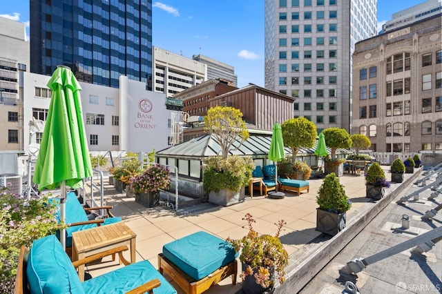 exterior space with central AC unit and a view of city