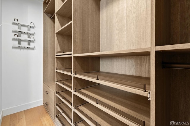 spacious closet featuring light wood-type flooring
