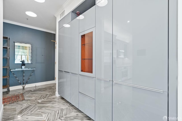 bathroom with baseboards and crown molding