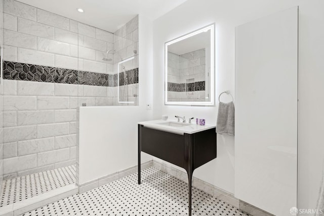 full bath featuring a walk in shower, recessed lighting, and vanity