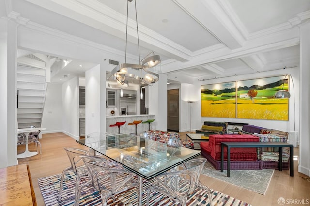 dining area featuring ornamental molding, beamed ceiling, a notable chandelier, and wood finished floors