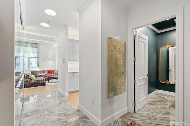 corridor featuring crown molding and baseboards