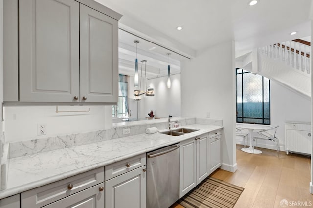 kitchen with light wood-style flooring, a sink, stainless steel dishwasher, beamed ceiling, and recessed lighting
