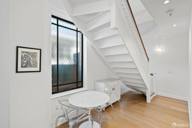 interior space with recessed lighting, baseboards, and wood finished floors