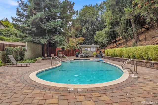 view of pool with a patio area