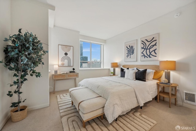 bedroom featuring light colored carpet and crown molding