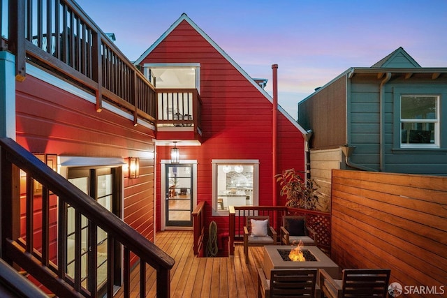 wooden deck featuring a fire pit