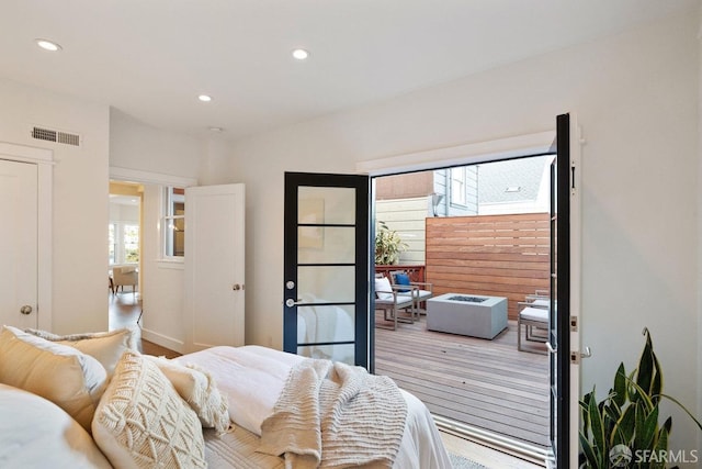 bedroom featuring visible vents, wood finished floors, and recessed lighting