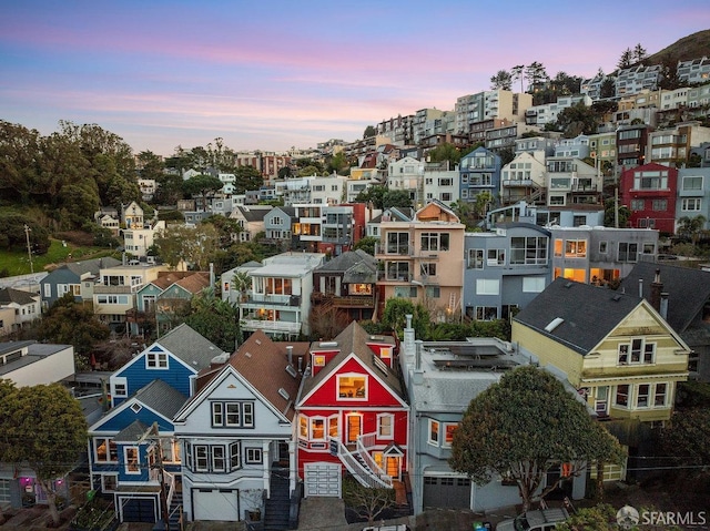 birds eye view of property with a residential view