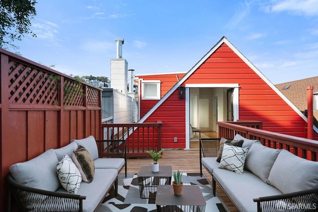 wooden deck featuring an outdoor hangout area