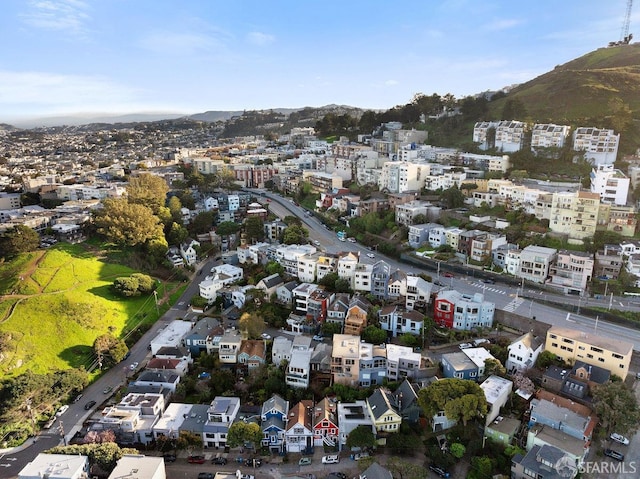 birds eye view of property with a mountain view