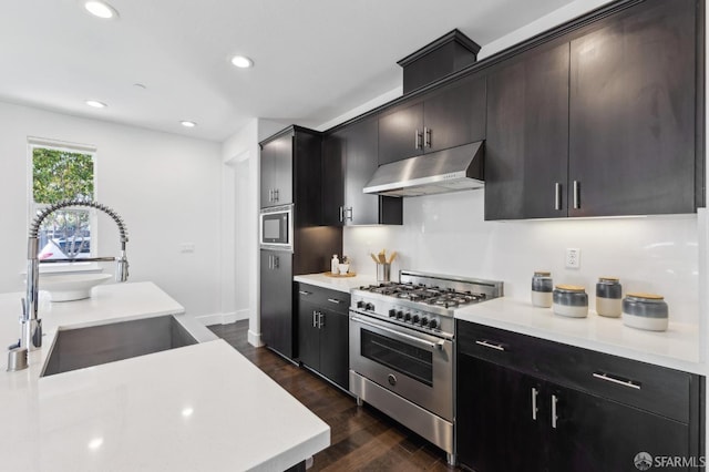 2768 Bette St, Alameda, CA 94501 - kitchen with high end range, under cabinet range hood, dark wood-style flooring, light countertops, and recessed lighting