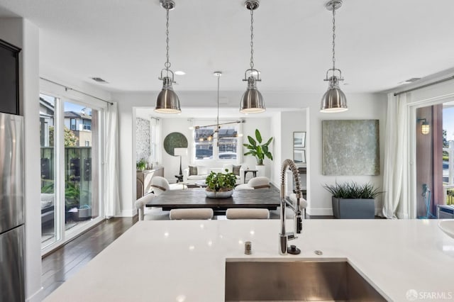 2768 Bette St, Alameda, CA 94501 - kitchen with open floor plan, wood finished floors, light countertops, and pendant lighting