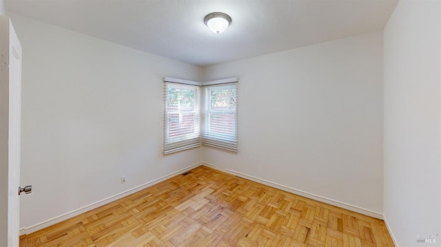 empty room with light parquet floors