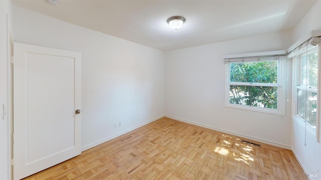 empty room with light parquet floors