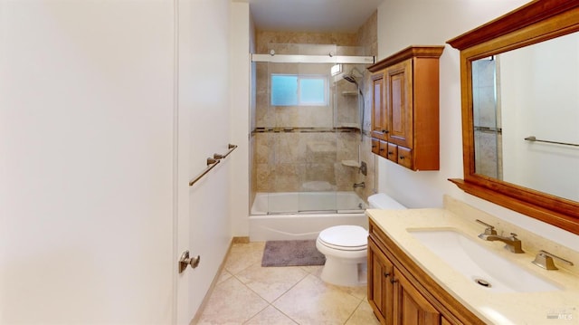 full bathroom with enclosed tub / shower combo, tile patterned floors, toilet, and vanity