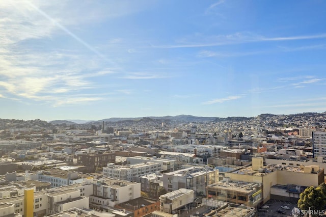 property's view of city featuring a mountain view