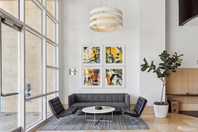 living room featuring a high ceiling