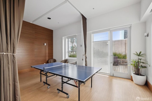 game room with light wood-type flooring