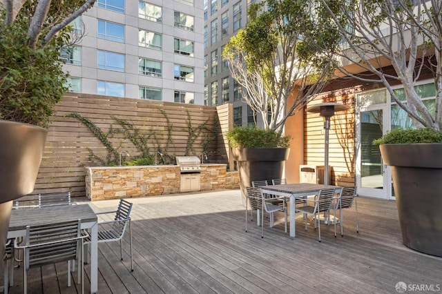 wooden deck with area for grilling and grilling area