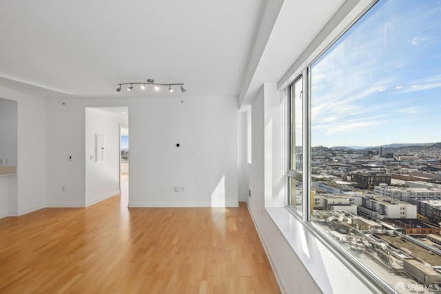 spare room with light wood-type flooring