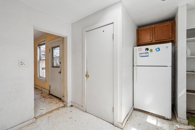 2714 Diamond St, San Francisco, CA 94131 - kitchen featuring freestanding refrigerator, light floors, and brown cabinets
