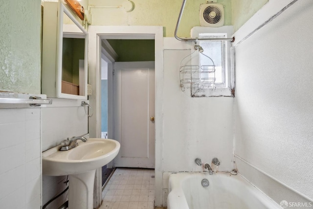 2714 Diamond St, San Francisco, CA 94131 - bathroom with a tub, tile patterned floors, and a textured wall