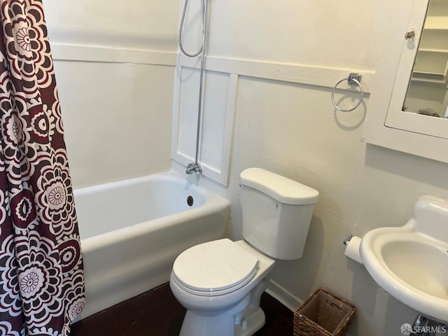 19 Moss St, San Francisco, CA 94103 - bathroom featuring shower / bathtub combination with curtain, toilet, wainscoting, and a sink