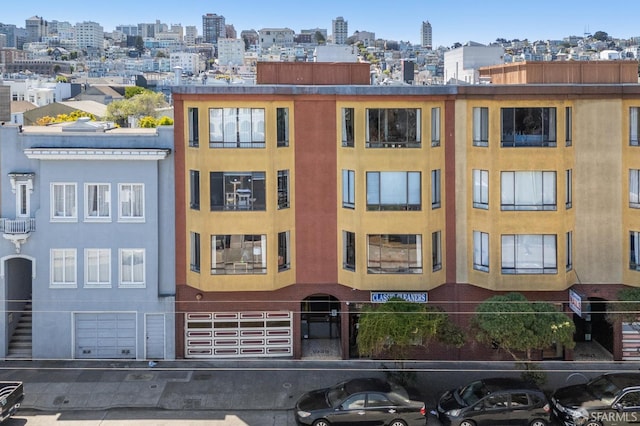 1949 Chestnut St, San Francisco, CA 94123 - view of property featuring a garage and a view of city