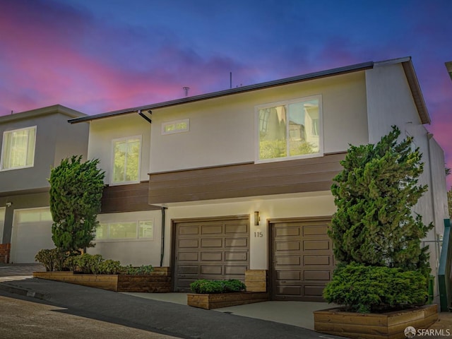 115 Gladeview Way, San Francisco, CA 94131 - view of front of property with stucco siding, an attached garage, and driveway