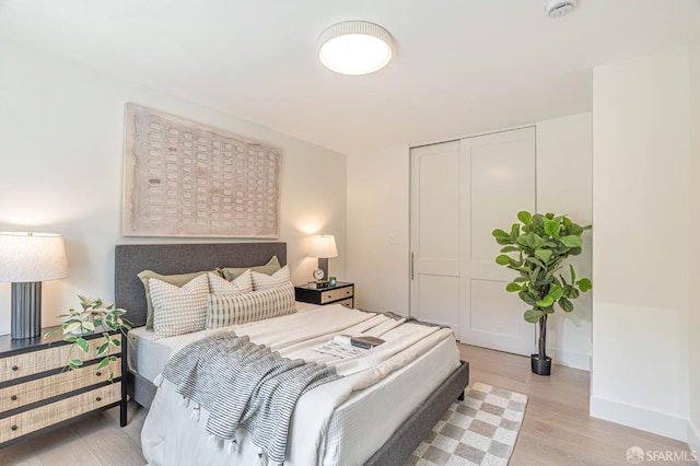 115 Gladeview Way, San Francisco, CA 94131 - bedroom with light wood-style flooring, a closet, and baseboards