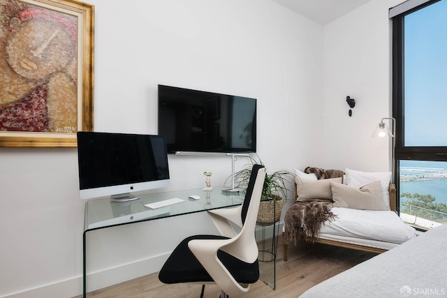 bedroom with wood finished floors