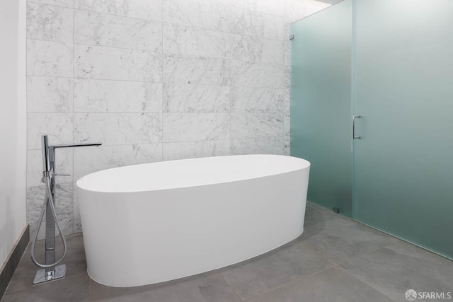 bathroom with a soaking tub