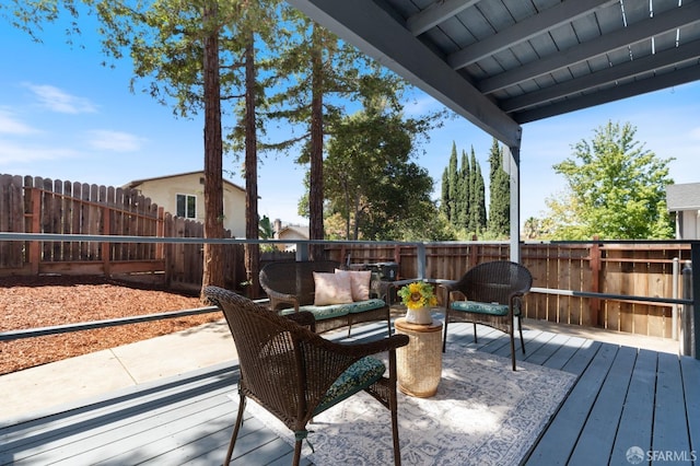 wooden deck with an outdoor living space