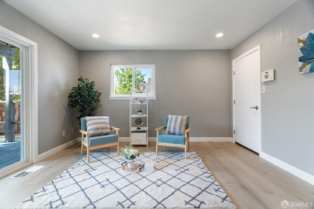 sitting room with light hardwood / wood-style flooring