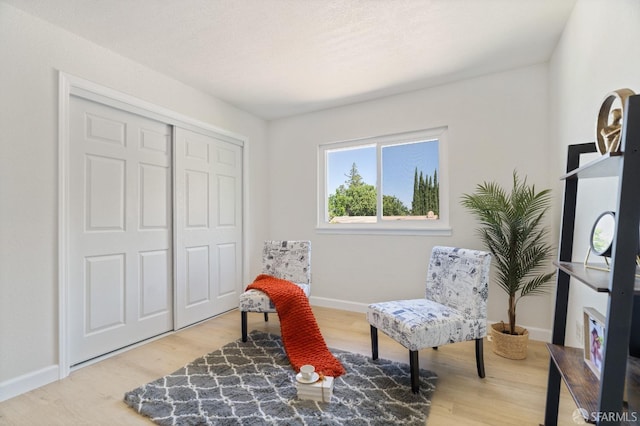 sitting room featuring hardwood / wood-style flooring