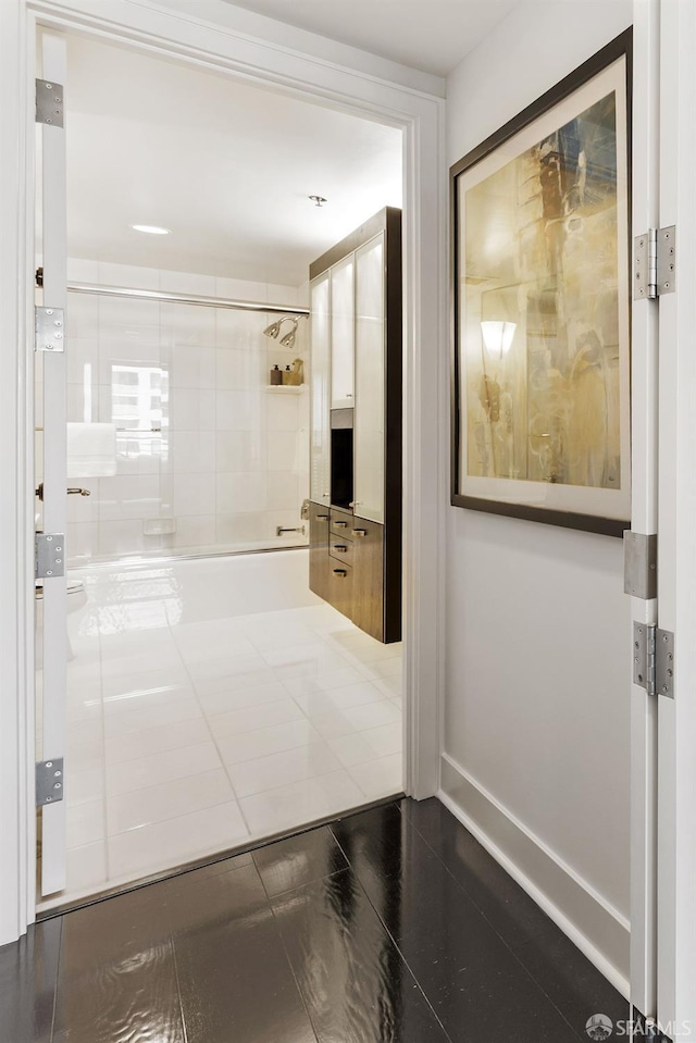 full bath featuring enclosed tub / shower combo