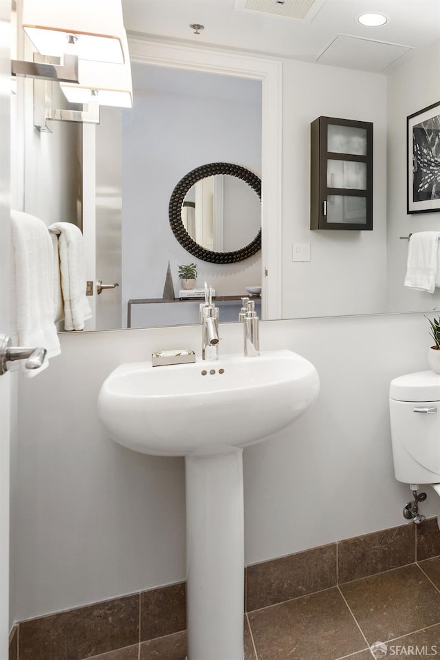 half bathroom with toilet