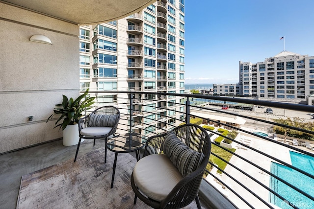 balcony featuring a water view