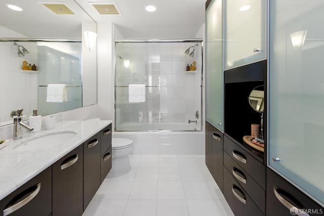 full bathroom featuring tile patterned floors, vanity, toilet, bath / shower combo with glass door, and recessed lighting